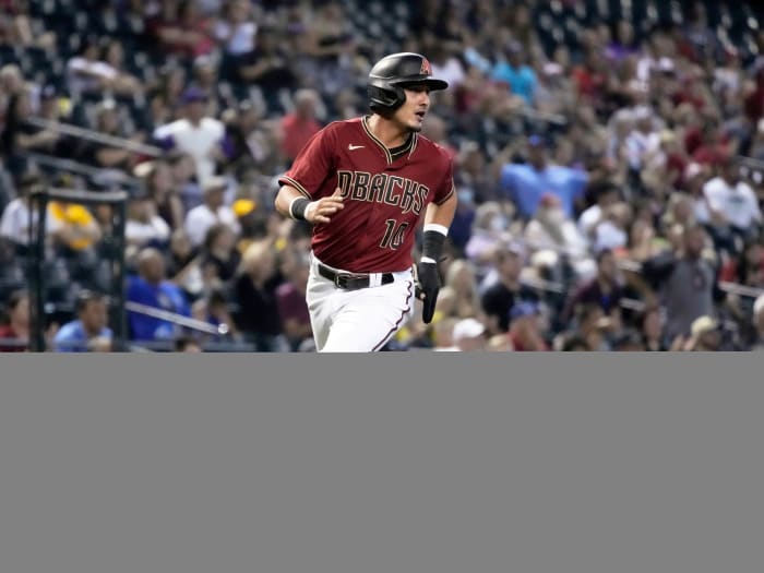 Aug 15, 2021; Phoenix, Arizona, USA; Arizona Diamondbacks third baseman Josh Rojas (10) scores a run against the San Diego Padres in the third inning at Chase Field.